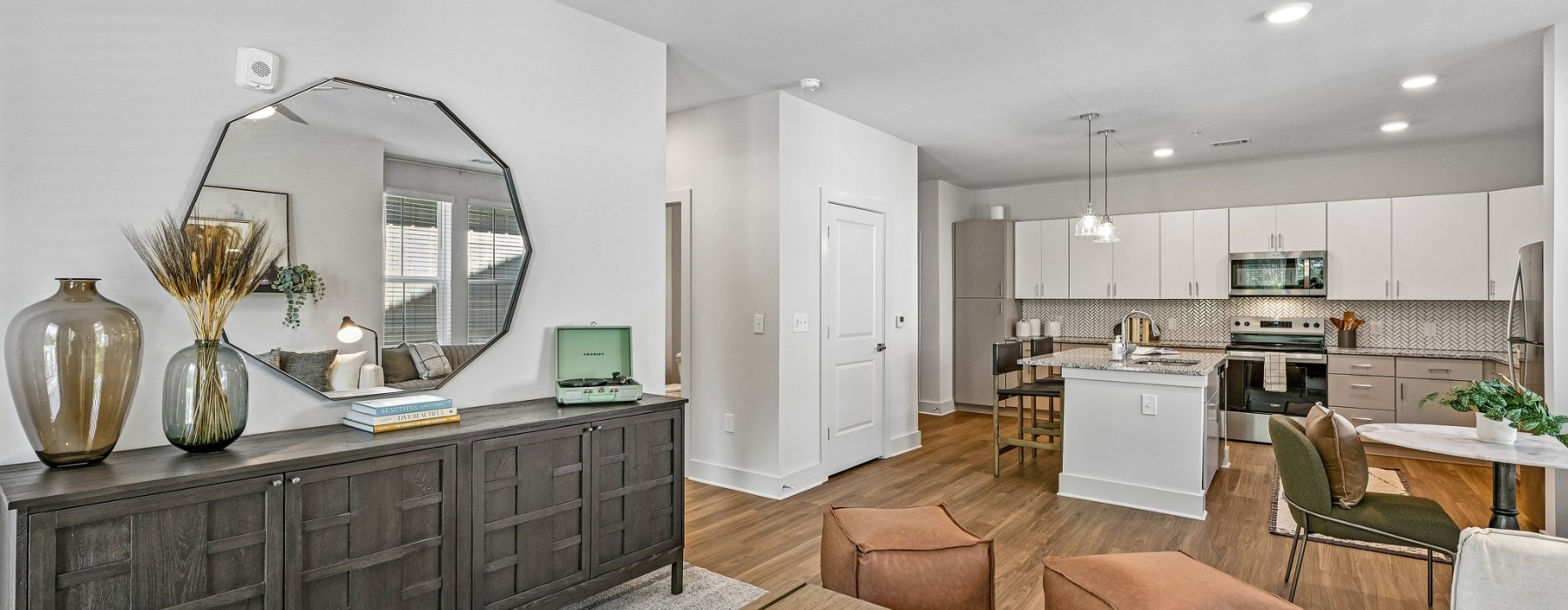 Bright open-concept living room inside luxury apartments on Mallard Creek Road Charlotte NC.
